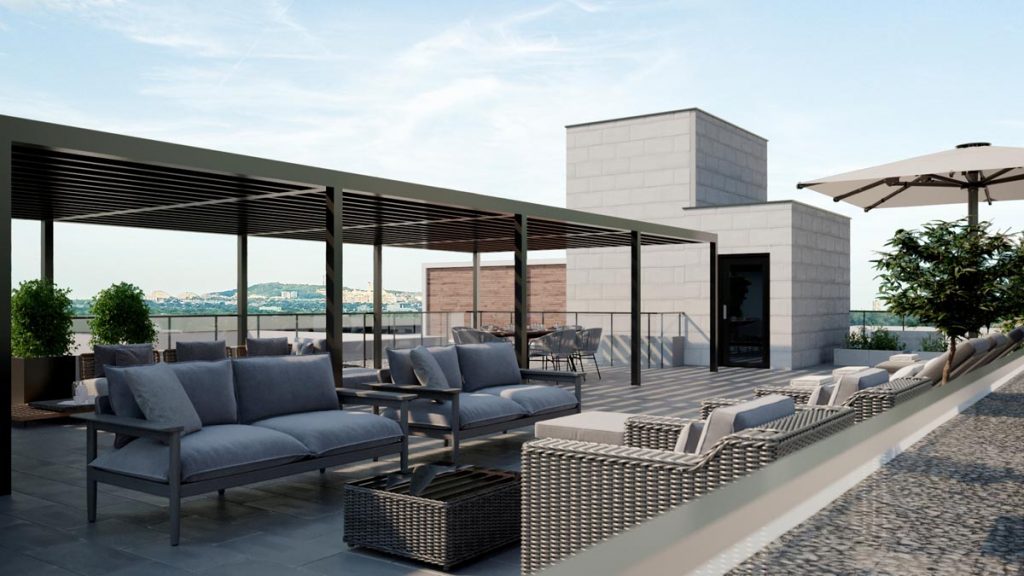 Terrasse avec coin cozy dans le projet de condos à louer Signature Bois-Franc, à Saint-Laurent, Montréal