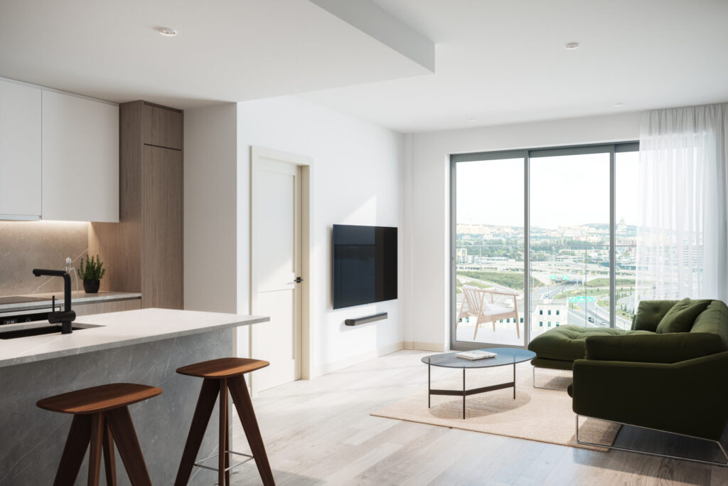 Cuisine et salon à aire ouverte dans un condo 3 1/2 à louer au sein du projet Signature Bois-Franc, à St-Laurent, Montréal.